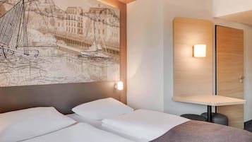 Een bureau, geluiddichte muren, gratis wifi, beddengoed