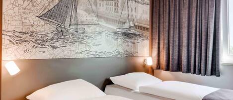 Escriptori, habitacions insonoritzades, wifi gratuïta i roba de llit