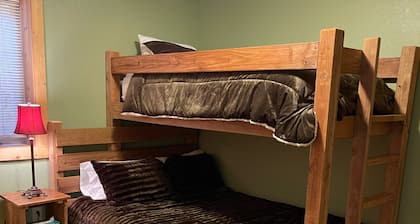 The Gathering Lodge is a relaxing, private log house with a stunning view.