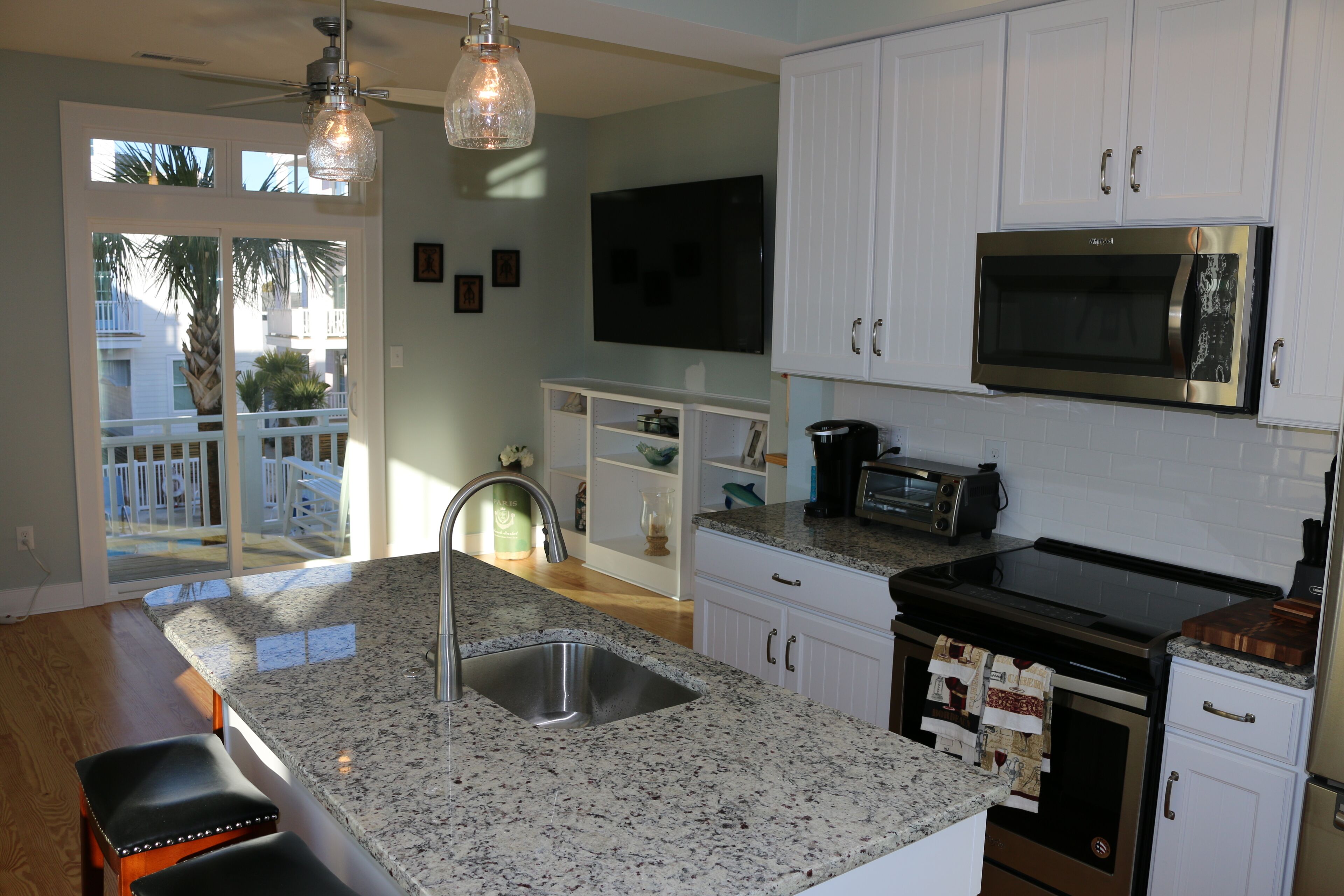 Kitchen with granite counters and stainless steel appliances.