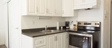 Microwave, coffee/tea maker, toaster, cookware/dishes/utensils