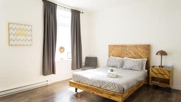 1 bedroom, desk, iron/ironing board, travel crib