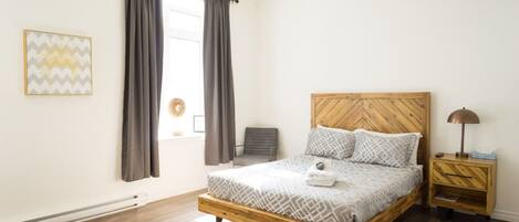 1 bedroom, desk, iron/ironing board, travel crib