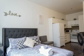 1 bedroom, desk, iron/ironing board, travel crib