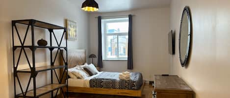 1 bedroom, desk, iron/ironing board, travel crib