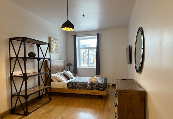 1 bedroom, desk, iron/ironing board, travel crib