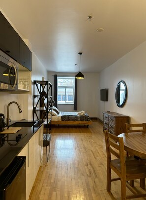 1 bedroom, desk, iron/ironing board, travel crib