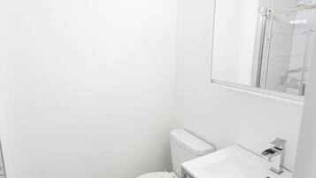 Shower, hair dryer, towels, shampoo