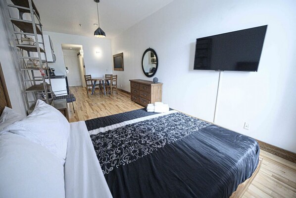 1 bedroom, desk, iron/ironing board, travel crib