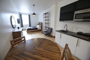 1 bedroom, desk, iron/ironing board, travel crib