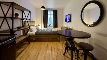 1 bedroom, desk, iron/ironing board, travel crib