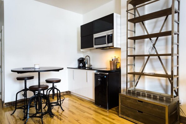 Fridge, microwave, stovetop, coffee/tea maker