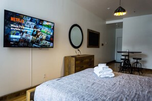 1 bedroom, desk, iron/ironing board, travel crib