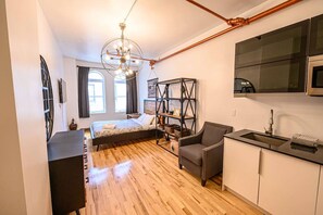 1 bedroom, desk, iron/ironing board, travel crib