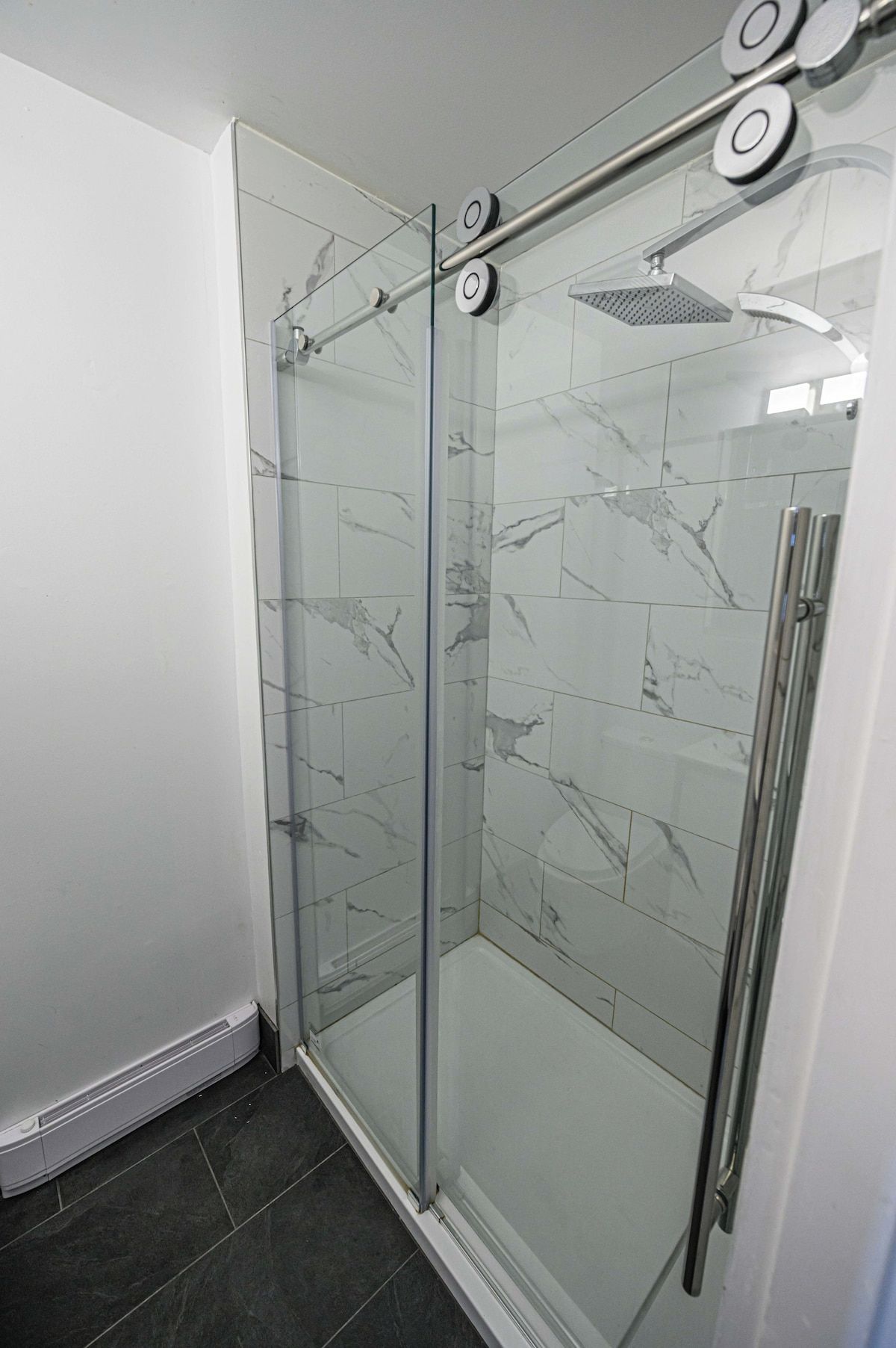 Shower, hair dryer, towels, shampoo