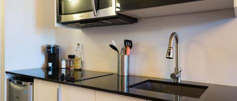 Fridge, microwave, stovetop, coffee/tea maker