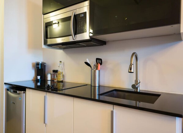 Fridge, microwave, stovetop, coffee/tea maker