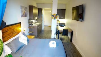 1 bedroom, desk, iron/ironing board, travel crib