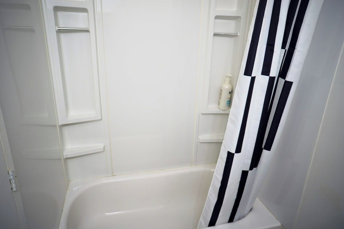 Shower, hair dryer, towels, shampoo