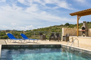 Seasonal outdoor pool, pool loungers