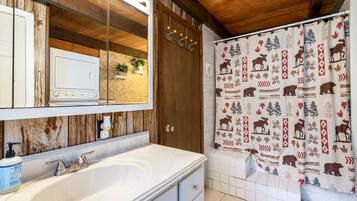 Bathtub, hair dryer, towels