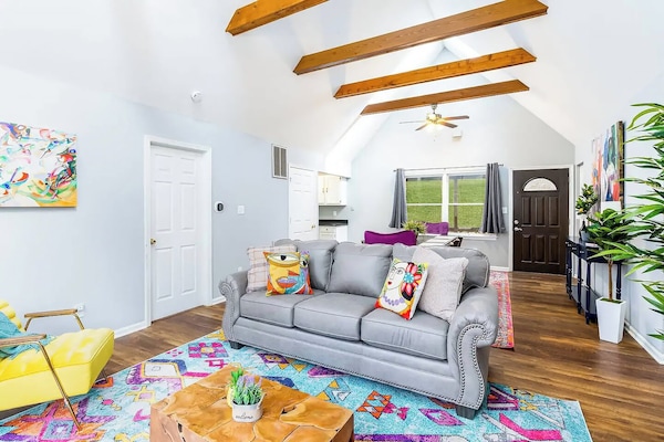 Take a look at the living room showing the balance of both basic and eye-popping colors.