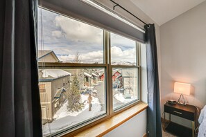 Enjoy a peaceful retreat with a view of the surrounding residential area from the large window.