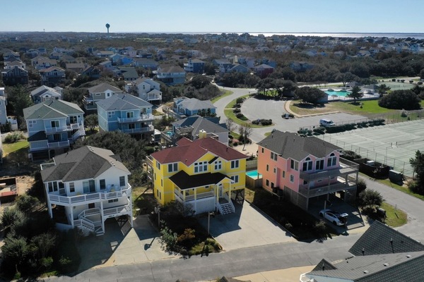 Our yellow house, 1 over from tennis courts and across the parking lot from pool