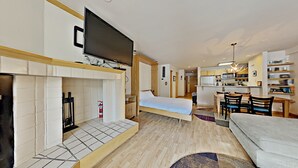 A modern apartment with a living room, a bedroom, and a kitchen. - Liftside 205 (Keystone)