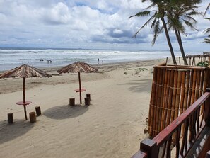 On the beach, sun-loungers