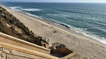 On the beach, sun loungers, beach towels