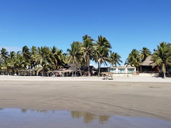 On the beach, sun-loungers