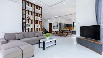 Premier Villa | Living area | 48-inch Smart TV with cable channels, TV, DVD player