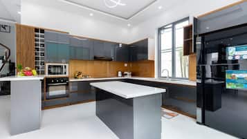 Premier Villa | Private kitchen | Fridge, microwave, oven, stovetop