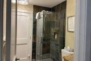 Shower, hair dryer, heated floors, towels