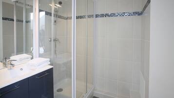 Shower, hair dryer, towels, soap