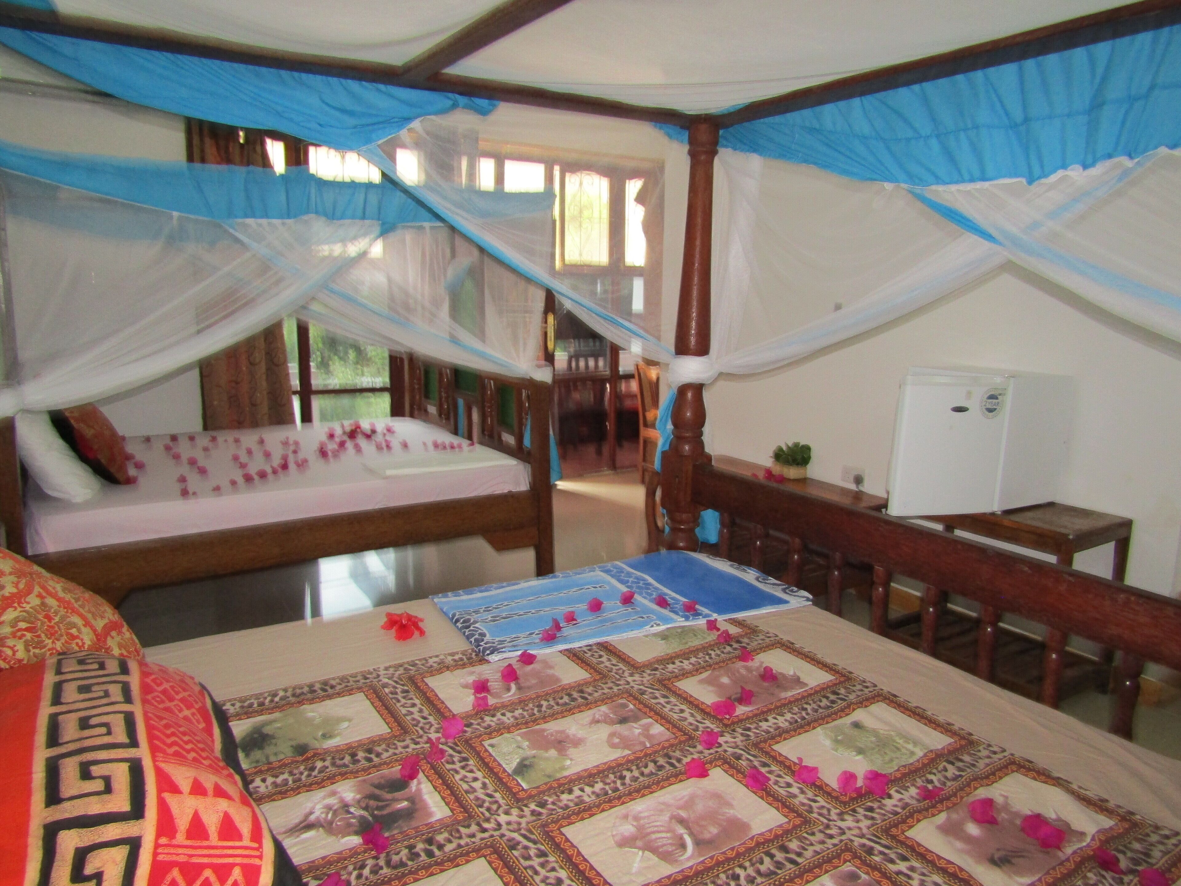 Deluxe Quadruple Room, Air conditioning, Garden View | Premium bedding, in-room safe, individually furnished, desk