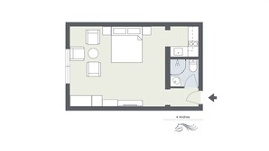 Un plan d’étage d’une chambre d’hôtel comprenant un lit, un bureau, une chaise, une petite table et une salle de bain.