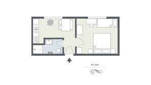 A floor plan of a hotel room with a kitchenette, a bathroom, a living area, and a bedroom.
