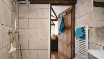 Shower, towels, soap, toilet paper