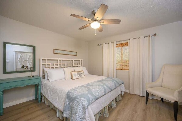 - Soft and simple bedroom features a comfy bed with calm blue and white tones - Ceiling fan and a cozy chair offer ways to cool off and kick back during your stay - Light wood floors and woven blinds tie in warm, natural touches throughout - On Cloud 9 | Gulf-Front, Private Beach (Santa Rosa Beach)