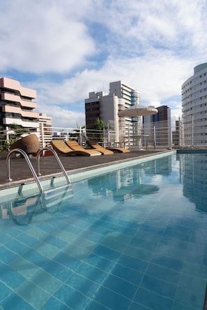 Outdoor pool, open 8:00 AM to 8:00 PM, pool umbrellas, pool loungers