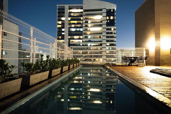 Outdoor pool, open 8:00 AM to 8:00 PM, pool umbrellas, sun loungers