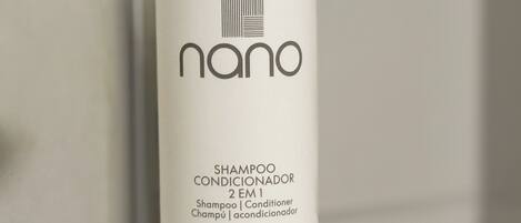 A white shampoo conditioner bottle labeled 'nano' with a barcode, 500ml volume, and multilingual product names.