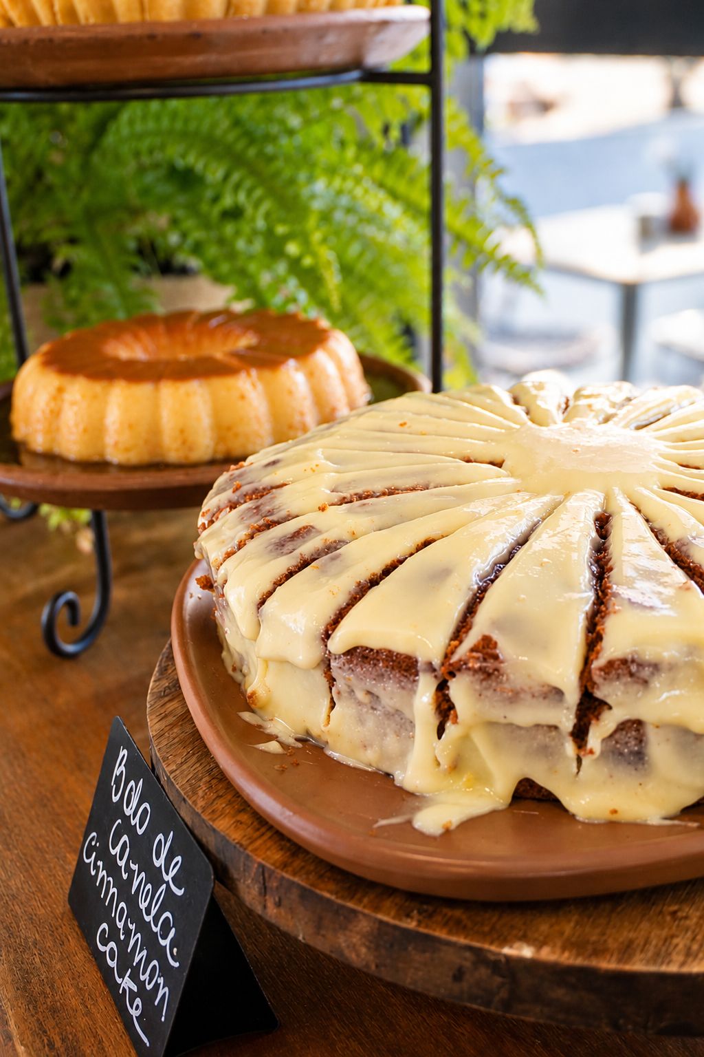 A dessert with a label indicating it is a cinnamon cake.