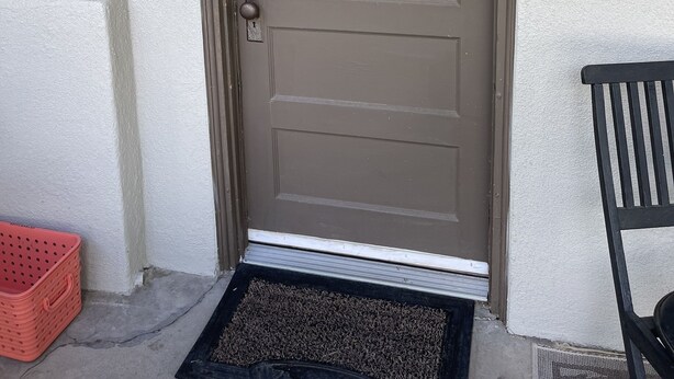A brown door with the number 219B, a mailbox, and a black bench outside. - Poppies Place @ The Pleasant Street Suites in downtown Prescott (Prescott)