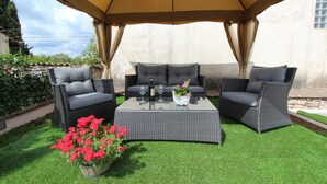 An outdoor seating area with two wicker sofas and a glass-top coffee table, under a canopy. - MIDEA 2 Comfort Studio with Terrace 5 (Rovinjsko Selo)
