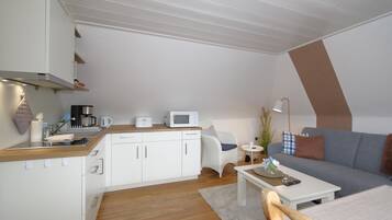 Fridge, coffee/tea maker, toaster, cookware/dishes/utensils