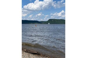 Enjoy serene lakeside views and scenic rolling hills from this peaceful lakeside retreat.