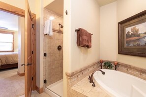 Bathtub, hair dryer, towels, soap